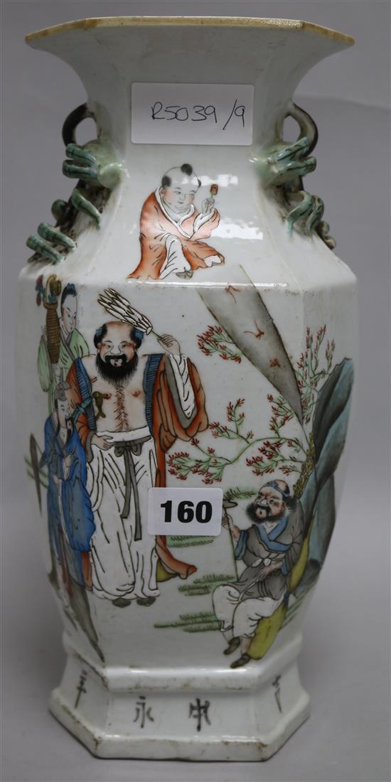 A Chinese porcelain vase decorated in enamels with figures in a garden 33cm